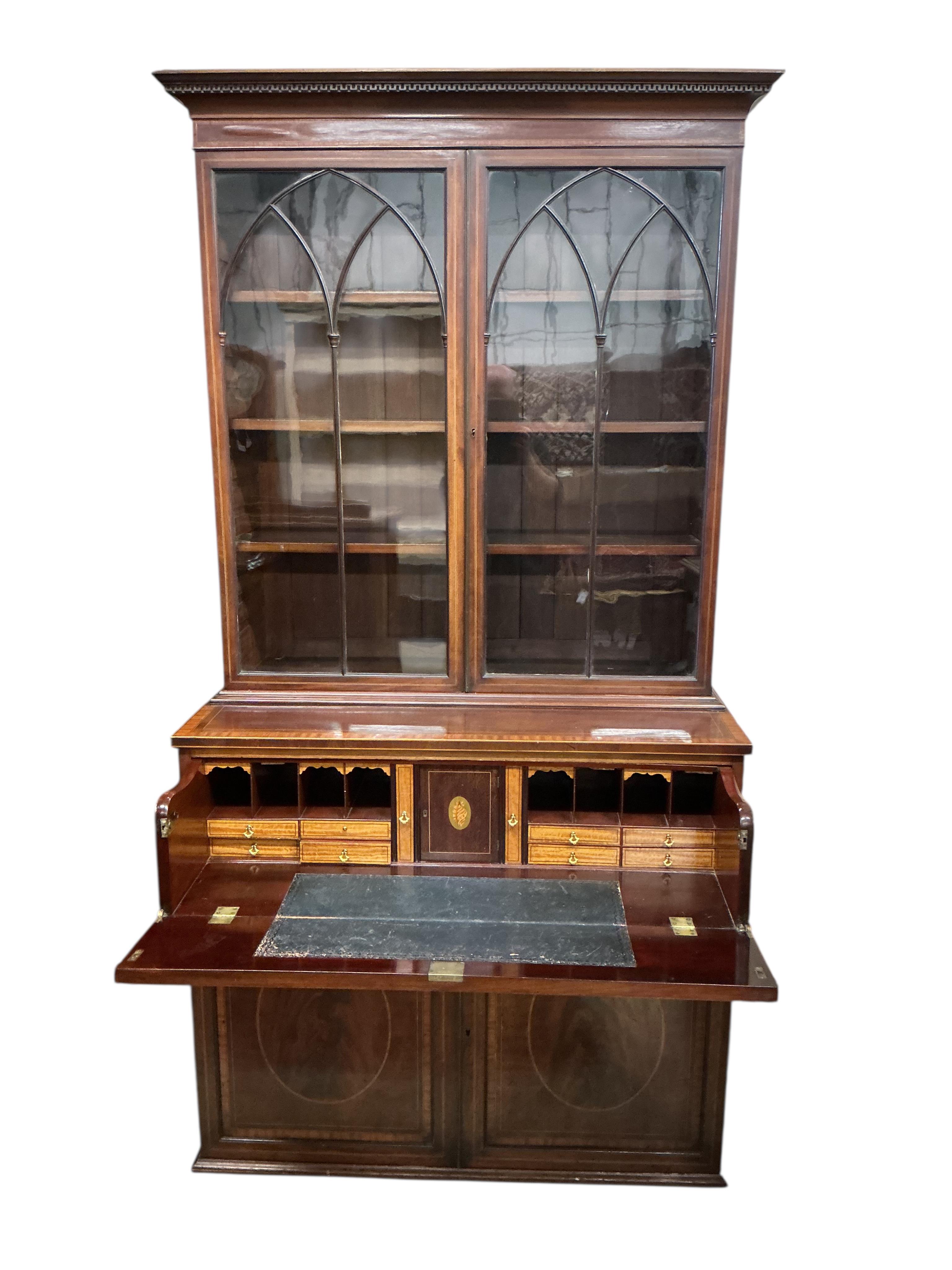 A George IV satinwood banded mahogany secretaire bookcase, width 104cm, depth 54cm, height 212cm